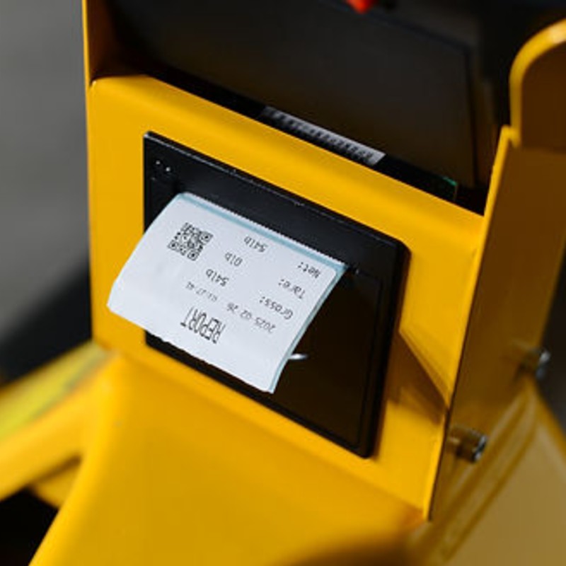 Manual pallet jack EKKO A25WL in yellow and black, equipped with a scale and printer, shown on a white background.