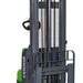  Lithium-powered straddle stacker with a 3000 lb capacity and 145" lift height, ideal for transporting goods.
