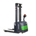 Electric straddle stacker with a 4000 lb capacity and 138" lift height, designed for efficient goods movement.