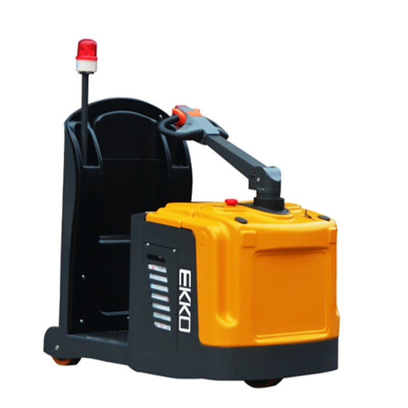 Small electric tow tractor with a red light, designed for towing up to 10,000 lbs, showcasing its compact design.
