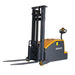 EKKO EK14C-130 electric stacker, a counterbalanced forklift with a 3000 lb capacity, positioned for loading tasks.