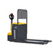 EKKO EP20E walkie pallet jack, featuring a yellow and black design, with a lifting capacity of 4400 lbs, in a storage area.