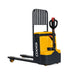 Electric hand truck EKKO EP25E, featuring a yellow and black design, with a capacity of 5500 lbs, positioned in a storage area.