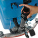 Close-up of the scrubber’s traction drive control and operator handle.