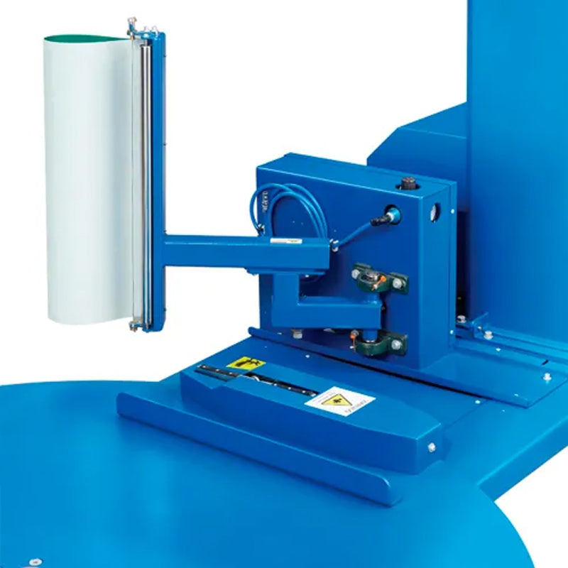 Close-up of the machine’s film attachment and cutting assembly beside the turntable.