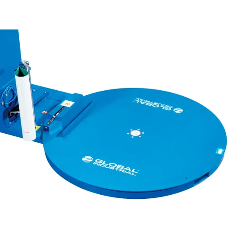 Close-up of the stretch wrapper’s circular turntable and film attachment mechanism.