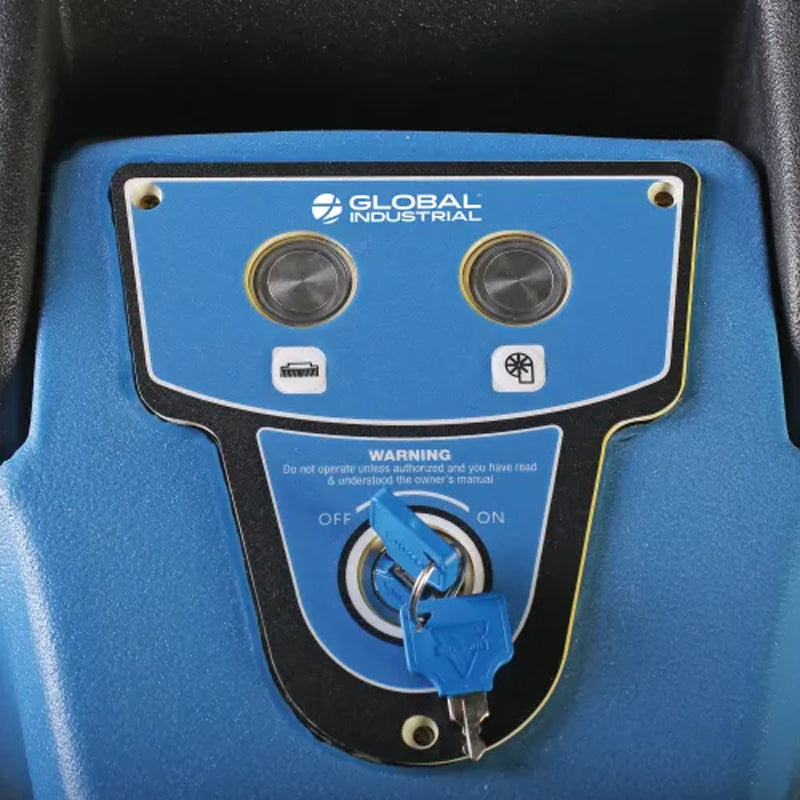 Close-up of the floor scrubber’s control panel with operating buttons and key switch.