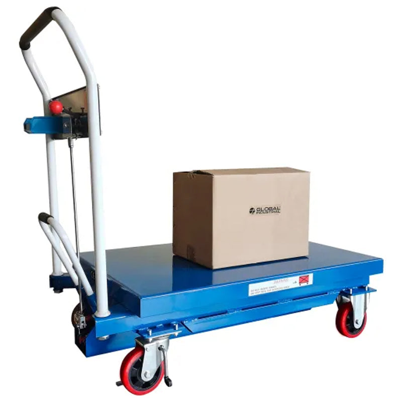 Mobile scissor lift table carrying a box on its lowered platform, with a hook-on bin attached beside the handle.