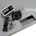 Pallet scale platform with the LCD indicator and connecting cables arranged beside it.