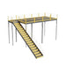  Metal stairway with yellow railing leading to a warehouse mezzanine, featuring bar grating and IBC approval.